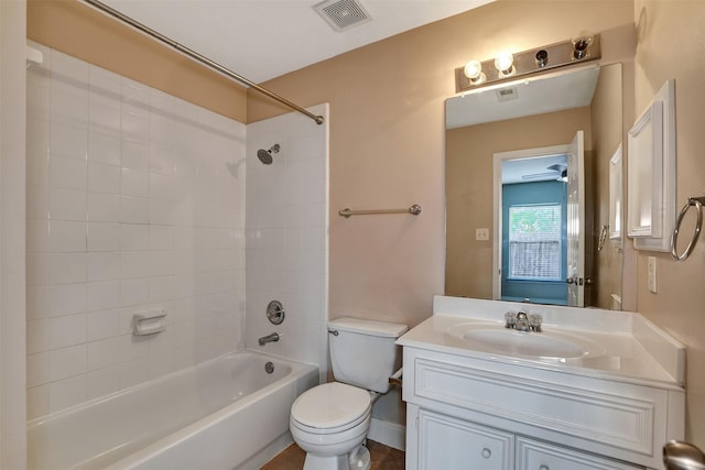 full bathroom with vanity, toilet, and tiled shower / bath