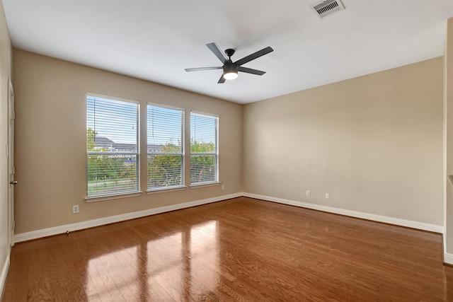 unfurnished room with ceiling fan and wood-type flooring