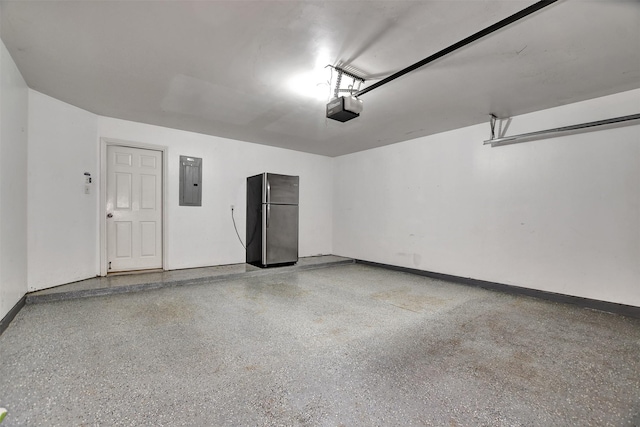 garage with electric panel, a garage door opener, and stainless steel refrigerator