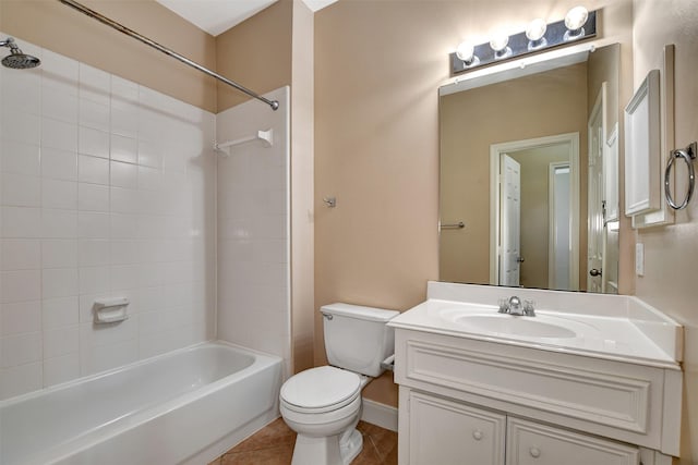 full bathroom featuring tile patterned flooring, vanity, tiled shower / bath combo, and toilet