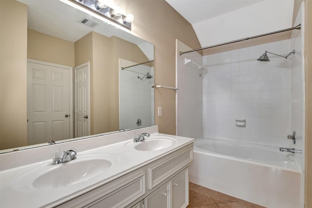 bathroom with vanity, tile patterned floors, and tiled shower / bath combo