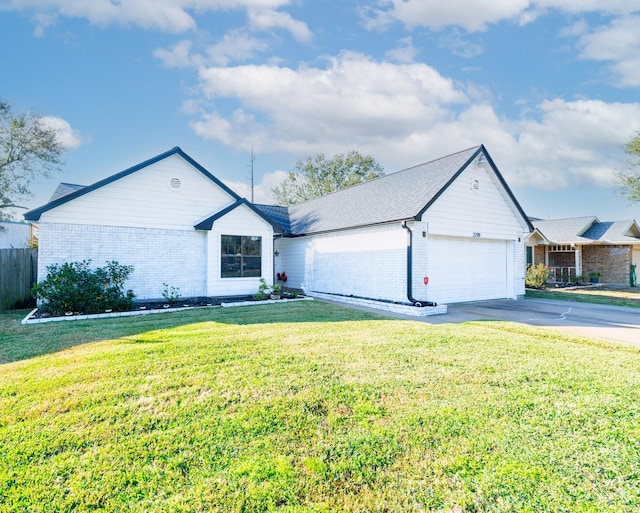 ranch-style home with a front yard and a garage