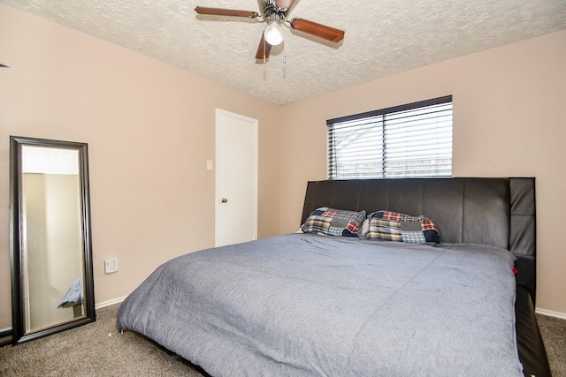 bedroom featuring ceiling fan, a textured ceiling, and carpet floors