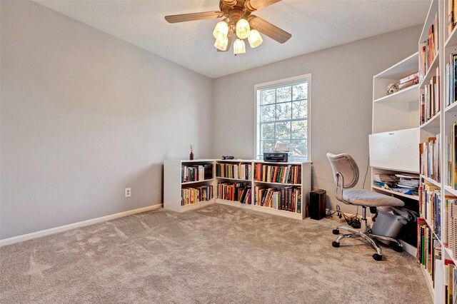 carpeted office with ceiling fan