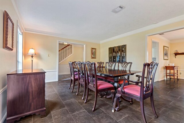 dining area with ornamental molding