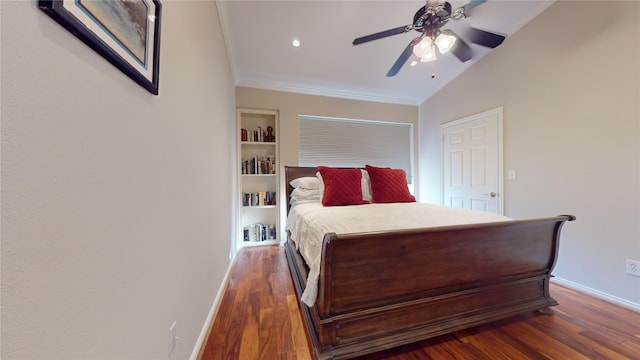 bedroom with ceiling fan, dark hardwood / wood-style floors, crown molding, and vaulted ceiling