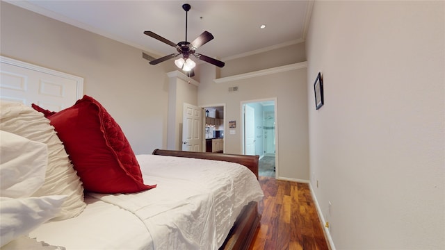 bedroom featuring connected bathroom, hardwood / wood-style flooring, ceiling fan, and ornamental molding