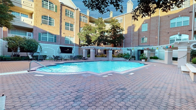 view of swimming pool featuring a patio area