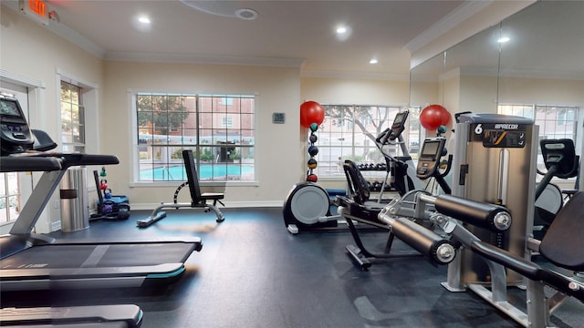 workout area featuring crown molding