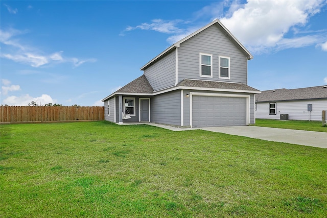 view of property with a garage, central air condition unit, and a front lawn