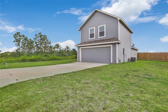 front facade with central AC, a garage, and a front lawn