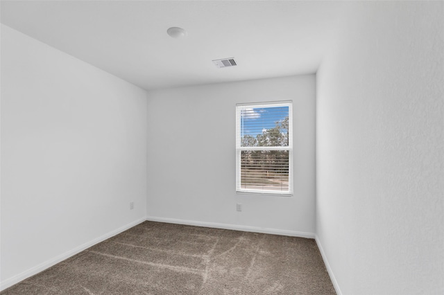 unfurnished room with carpet floors