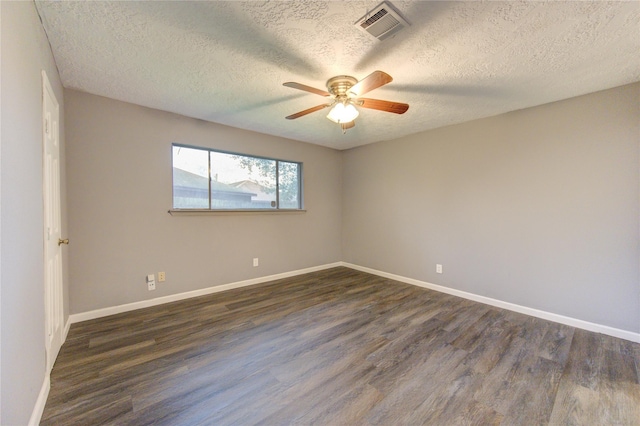 unfurnished room featuring ceiling fan, dark wood-type flooring, and a textured ceiling