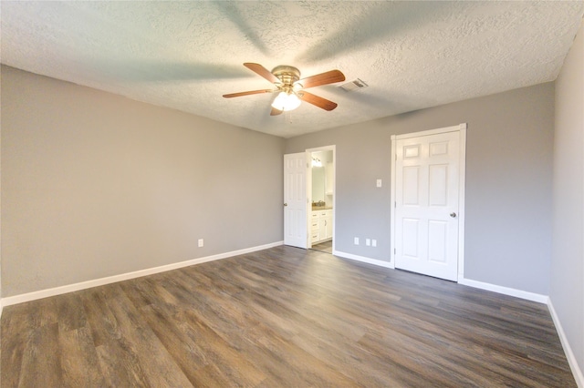 unfurnished bedroom featuring a textured ceiling, ceiling fan, and dark hardwood / wood-style floors