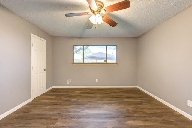 empty room with ceiling fan, a textured ceiling, and dark hardwood / wood-style flooring