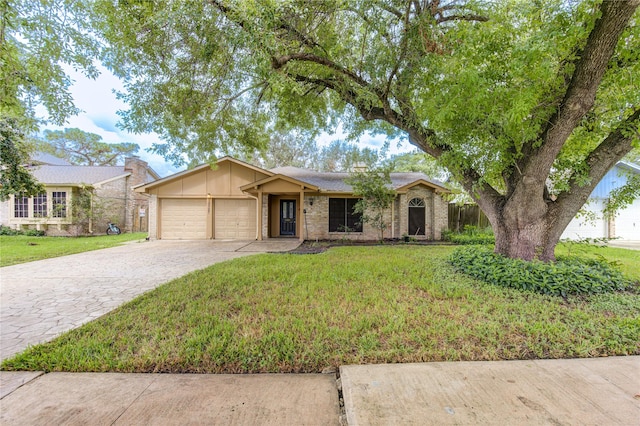 ranch-style house featuring a garage and a front lawn