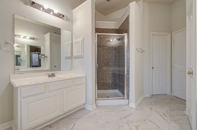 bathroom with vanity and a shower with door