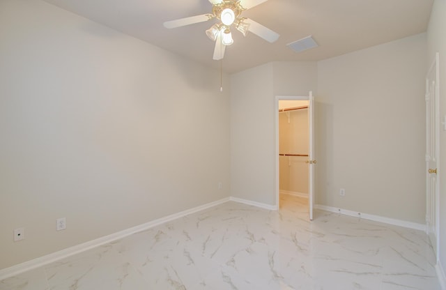 spare room with ceiling fan