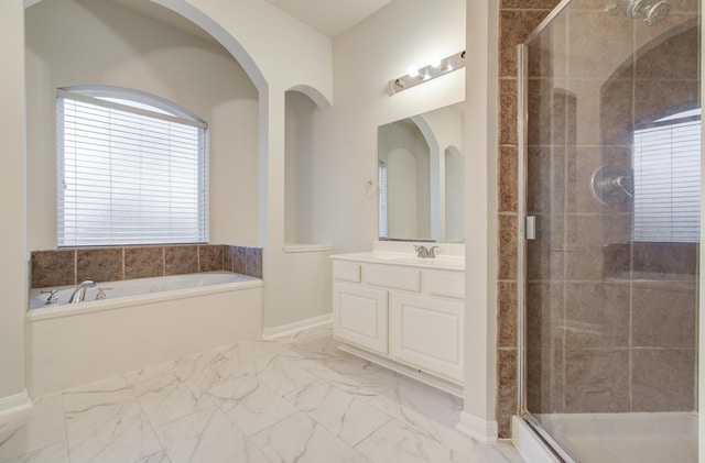 bathroom featuring vanity and plus walk in shower