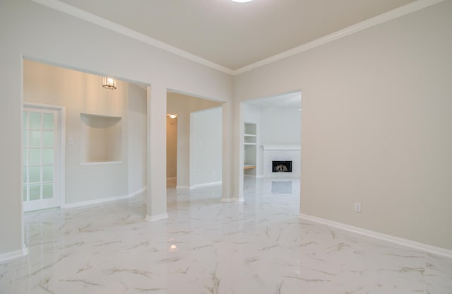 unfurnished room with a fireplace and crown molding