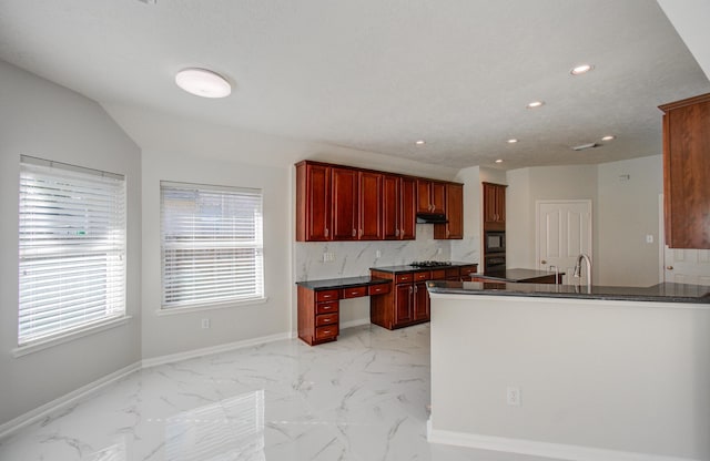 kitchen featuring kitchen peninsula, gas cooktop, backsplash, black microwave, and lofted ceiling