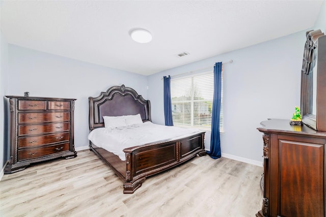 bedroom with light hardwood / wood-style floors