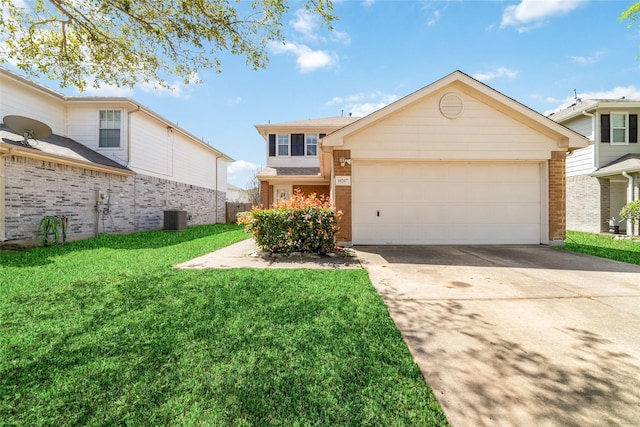 front of property featuring a front lawn and a garage