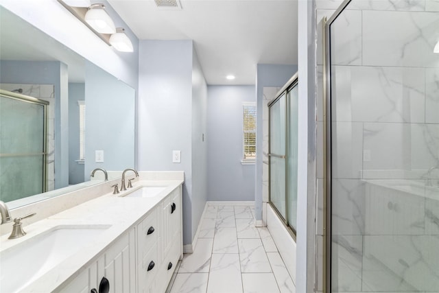 bathroom with vanity and enclosed tub / shower combo