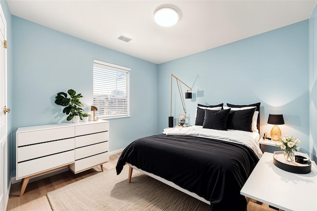 bedroom featuring light wood-type flooring