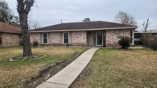 ranch-style home with a front yard