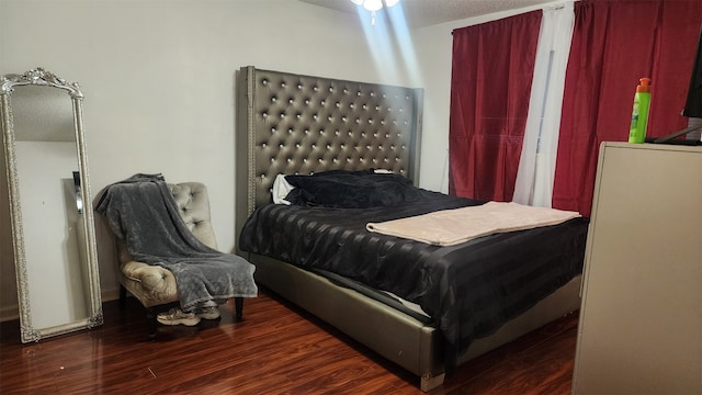 bedroom featuring dark hardwood / wood-style floors