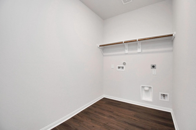 laundry room featuring washer hookup, electric dryer hookup, dark hardwood / wood-style flooring, and hookup for a gas dryer