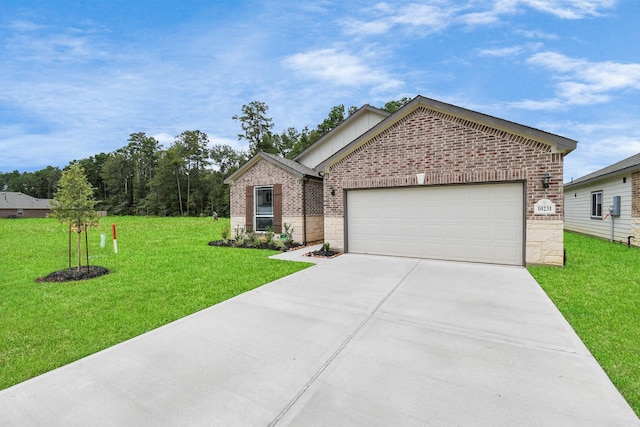 view of front of property with a front lawn and a garage