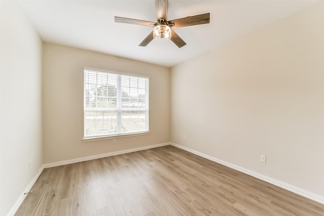 unfurnished room with ceiling fan and light wood-type flooring