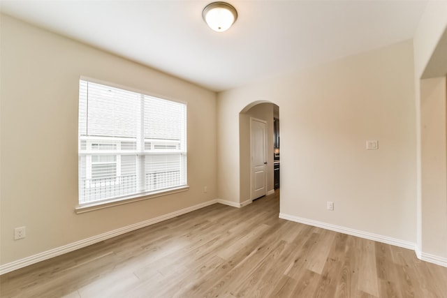 spare room featuring light wood-type flooring