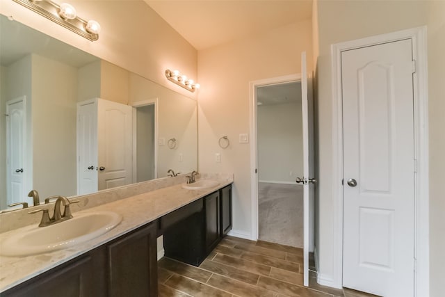 bathroom with hardwood / wood-style floors and vanity