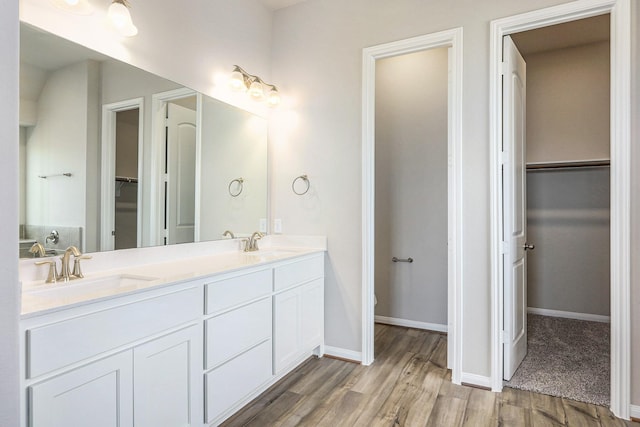 bathroom featuring vanity and hardwood / wood-style flooring