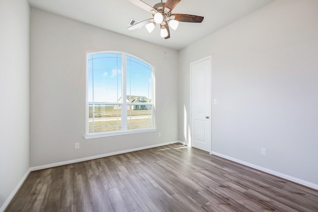 empty room with ceiling fan and wood-type flooring