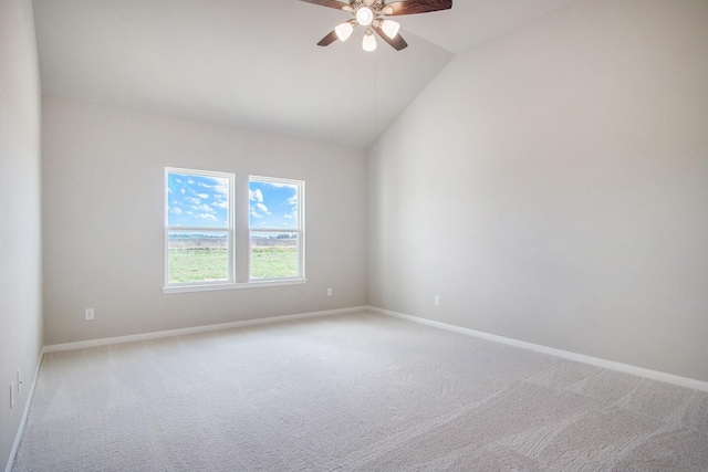 unfurnished room featuring ceiling fan, light colored carpet, and vaulted ceiling