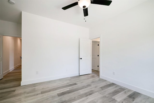 spare room featuring ceiling fan and light hardwood / wood-style floors