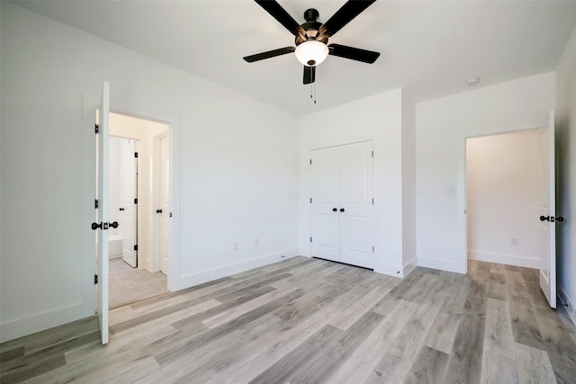 unfurnished bedroom with ceiling fan, a closet, and light hardwood / wood-style flooring