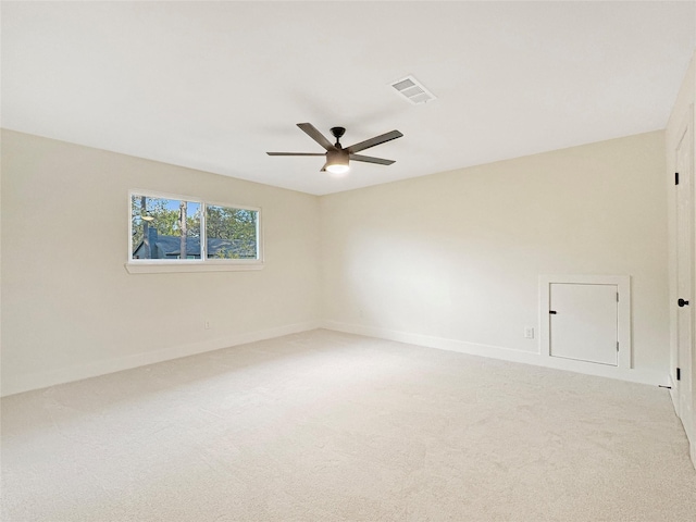 unfurnished room with ceiling fan and carpet flooring