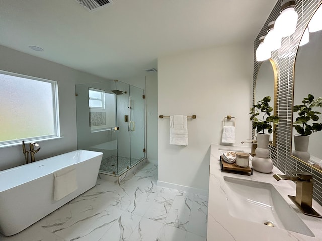 bathroom featuring vanity and shower with separate bathtub