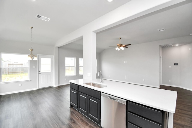 kitchen featuring dark hardwood / wood-style flooring, stainless steel dishwasher, ceiling fan, sink, and a center island with sink