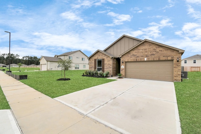 view of front of house featuring a front yard and a garage