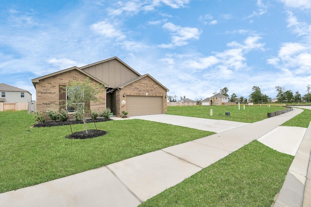 view of front of home featuring a front yard and a garage