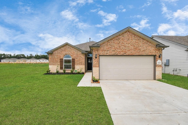 view of front of property with a garage and a front lawn