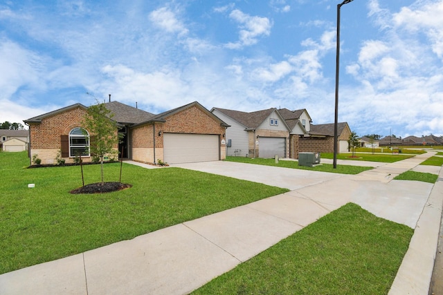 ranch-style home featuring a front lawn and a garage