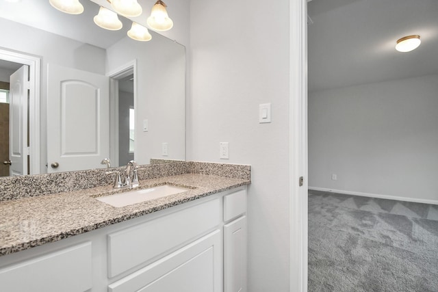 bathroom featuring vanity and a chandelier