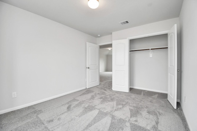 unfurnished bedroom with a closet and carpet